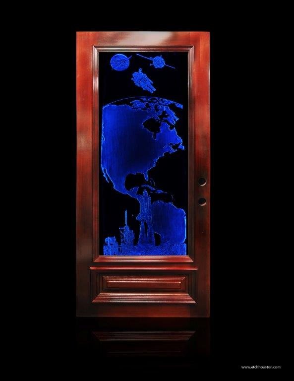 A door glass panel carved with the globe, a satellite and a launch tower, lit blue from within.