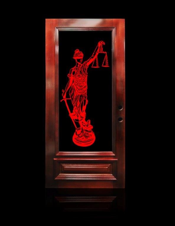 A door glass panel carved with a figure of Justice holding scales and a sword, lit red from within.
